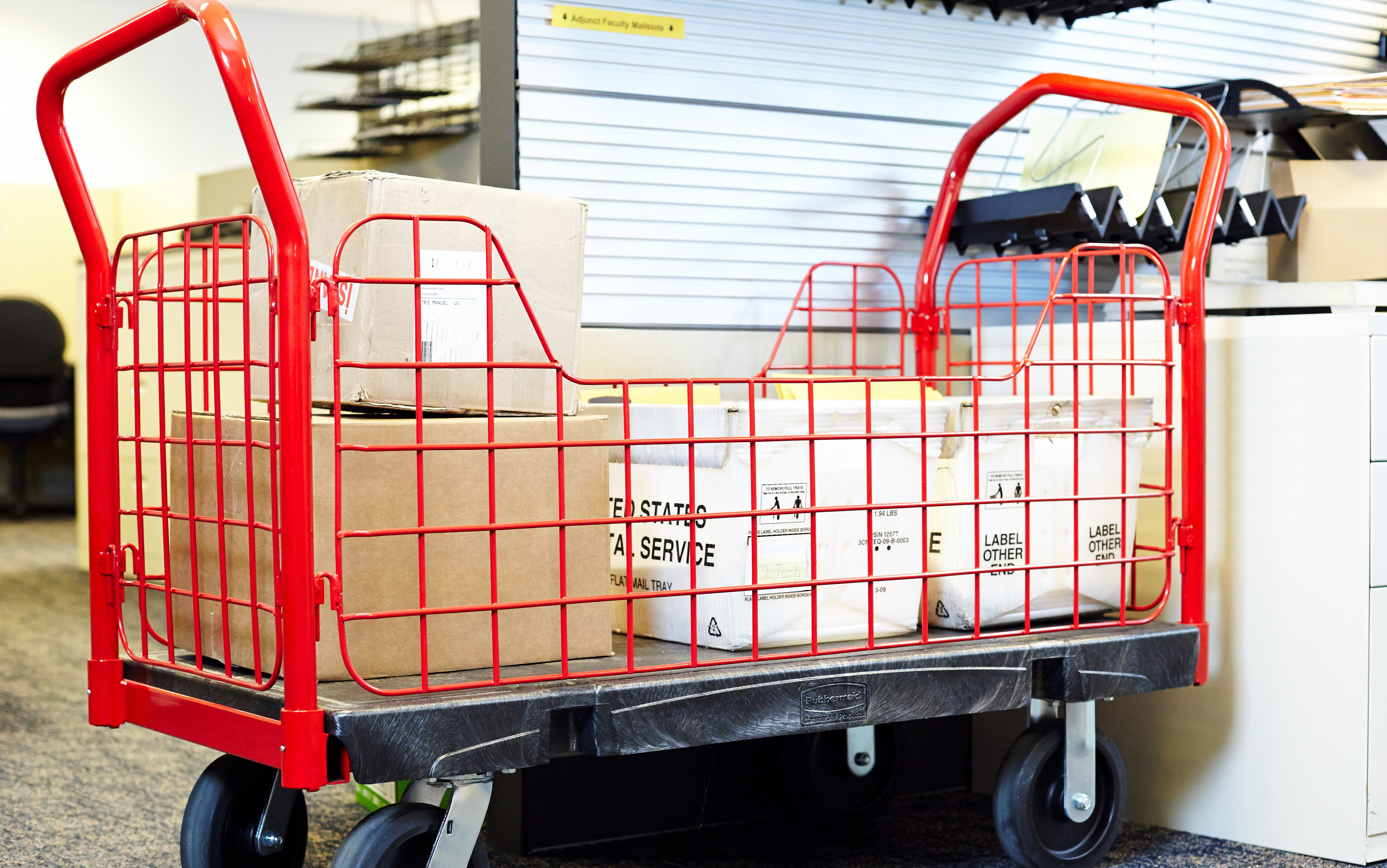 The Rubbermaid Commercial Side Panel Platform Truck 24"X36" with 6"TPR casters, 1000 lb. capacity