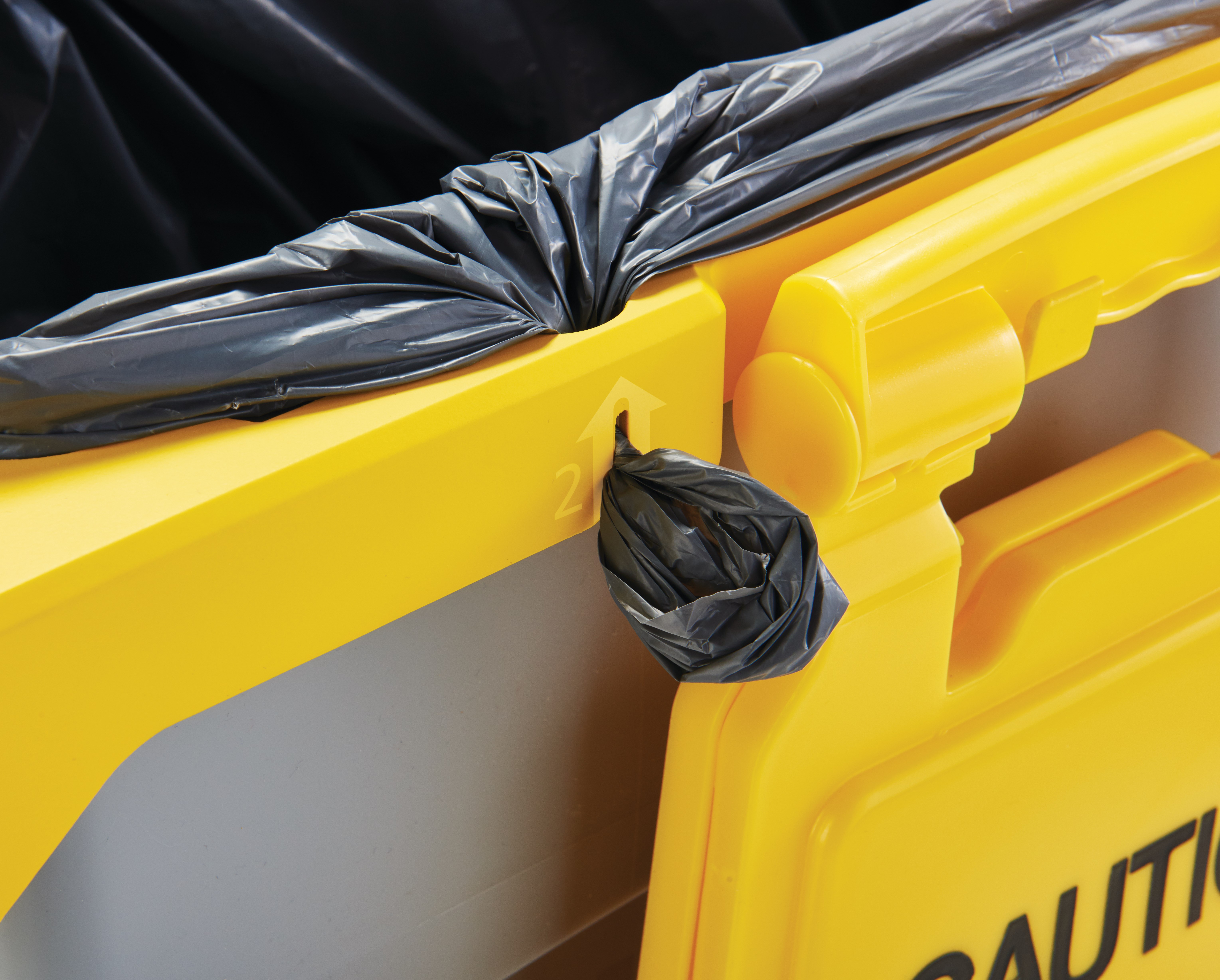 Slim Jim® Rim Caddy Kit compactly holds various cleaning tools including brooms, dustpans, safety signs, spray bottles, extra can liners, and more.