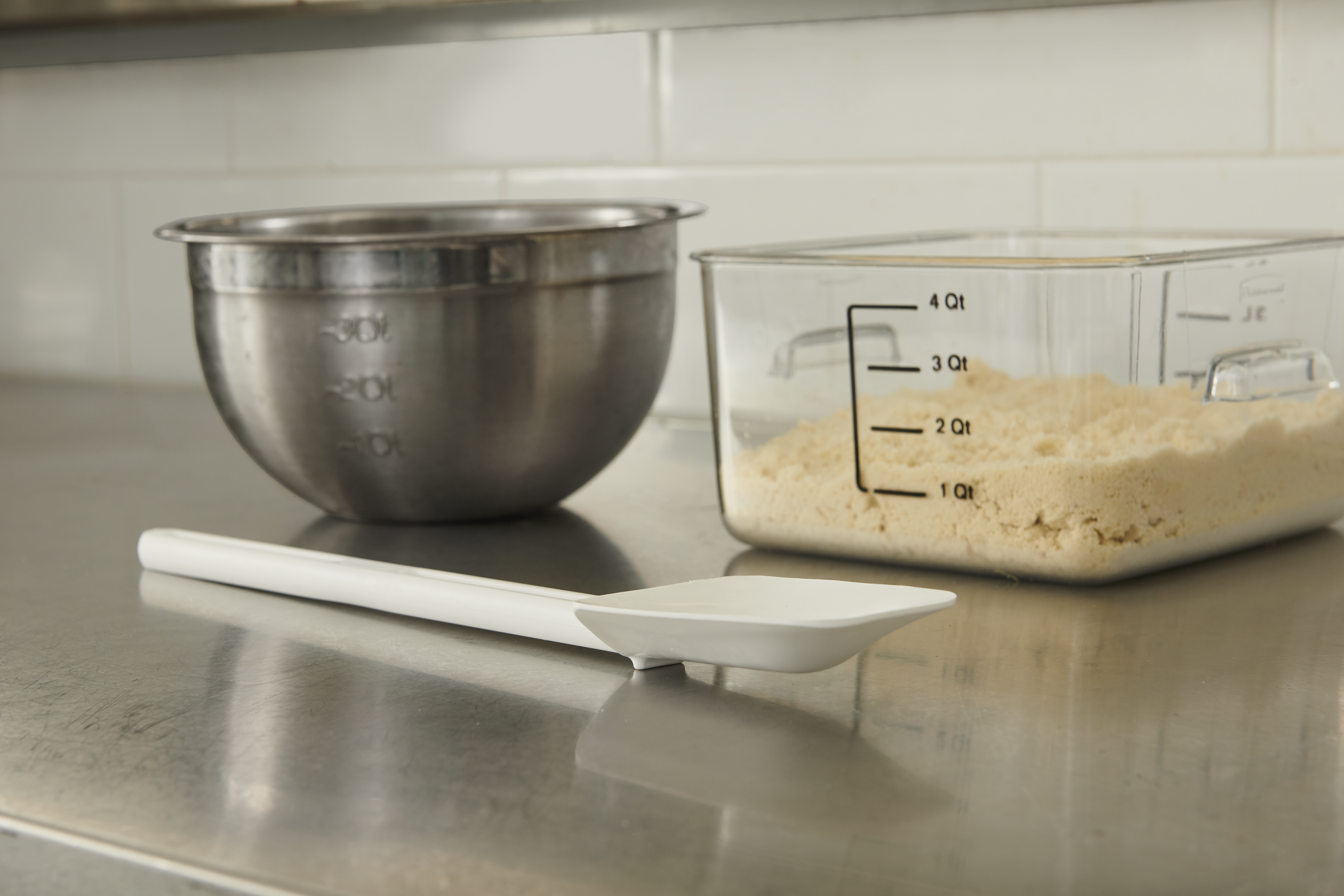 The Rubbermaid Commercial Spatula features traditional flat blades for scraping and spoon-shaped blades for easy spooning, scooping, and spreading.