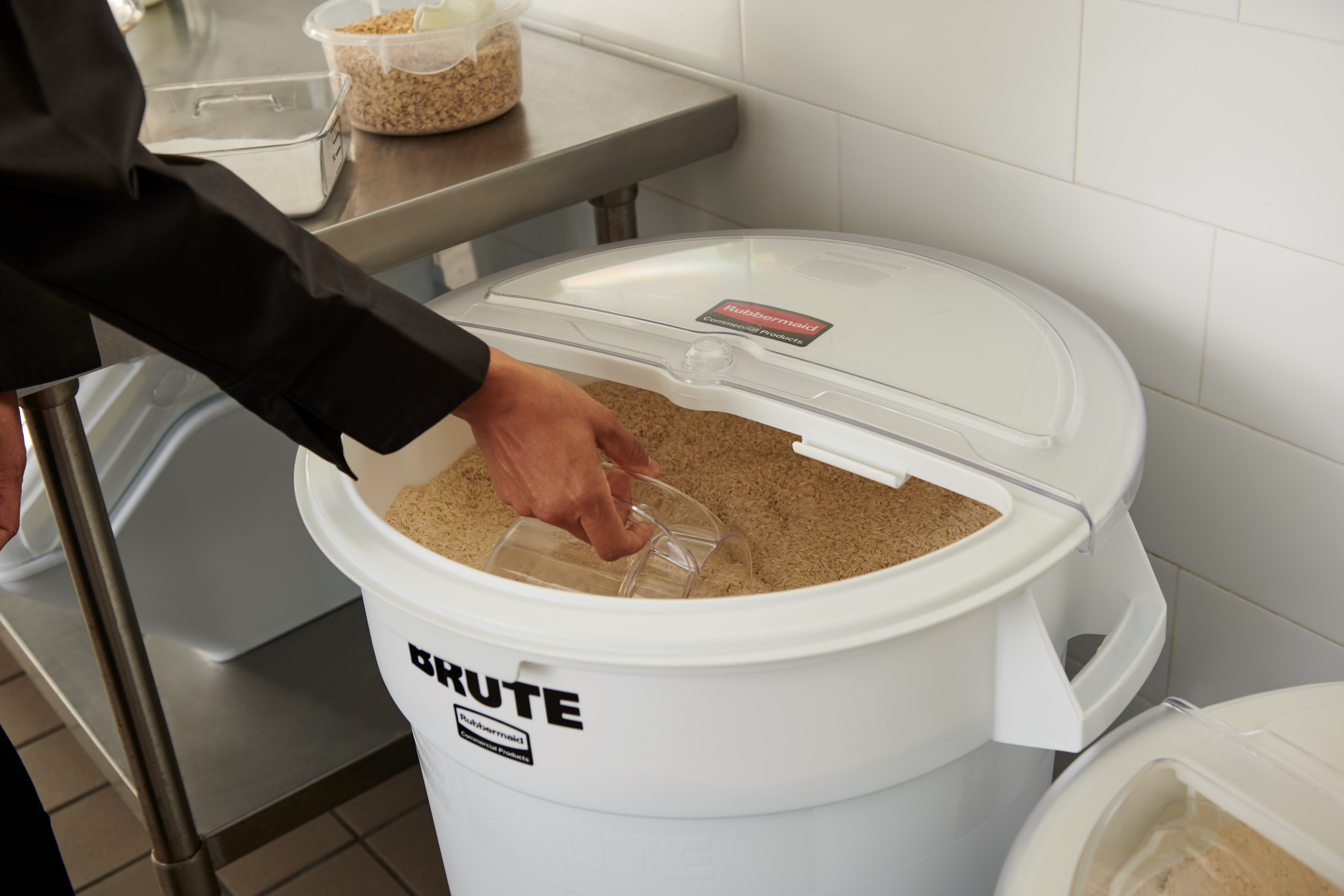 The Rubbermaid Commercial BRUTE® ingredient containers with sliding ProSave® lid and scoop