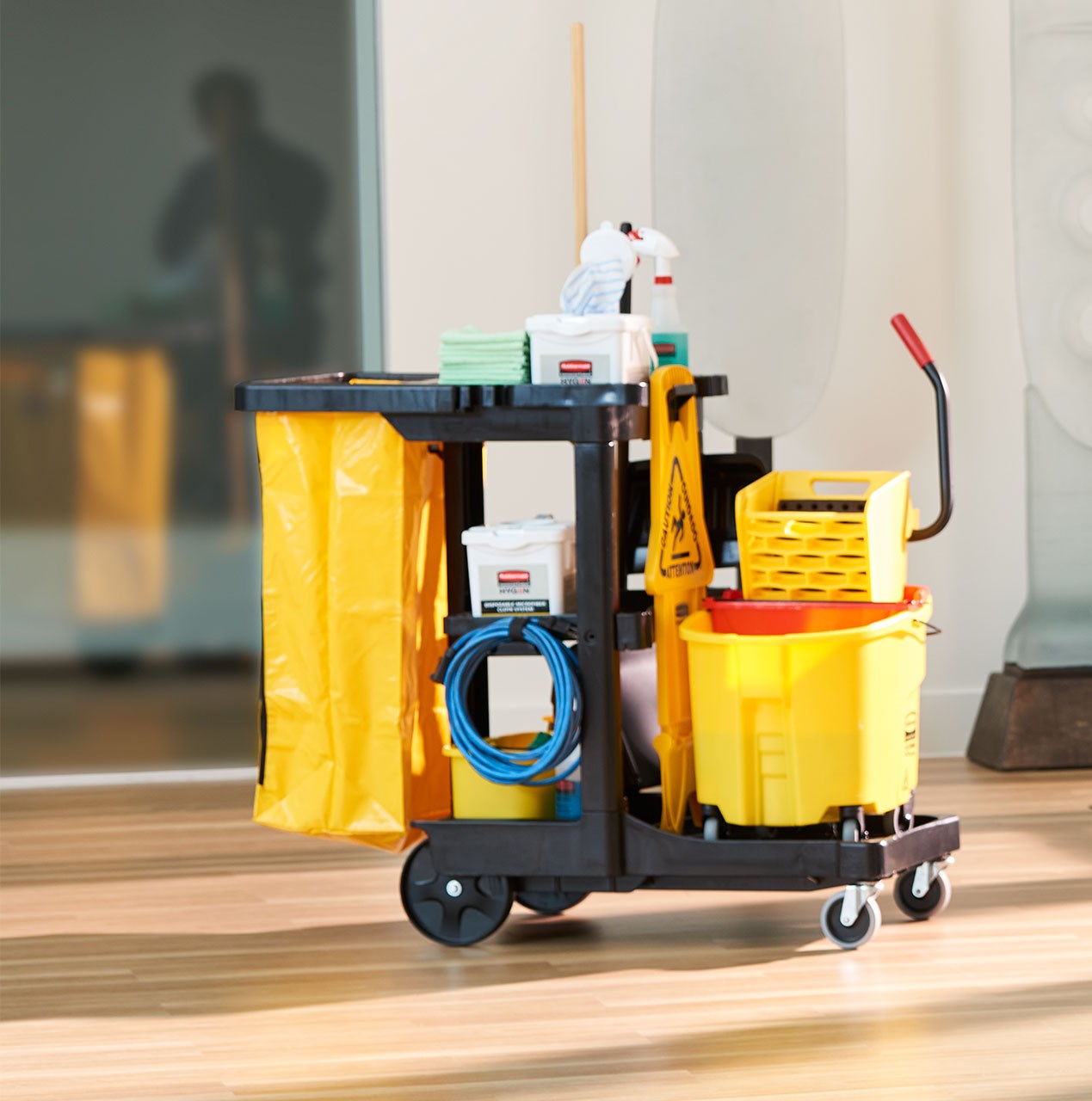 The Traditional Janitorial Cleaning Cart with zippered yellow vinyl bag collects waste and transports tools for efficient cleaning.