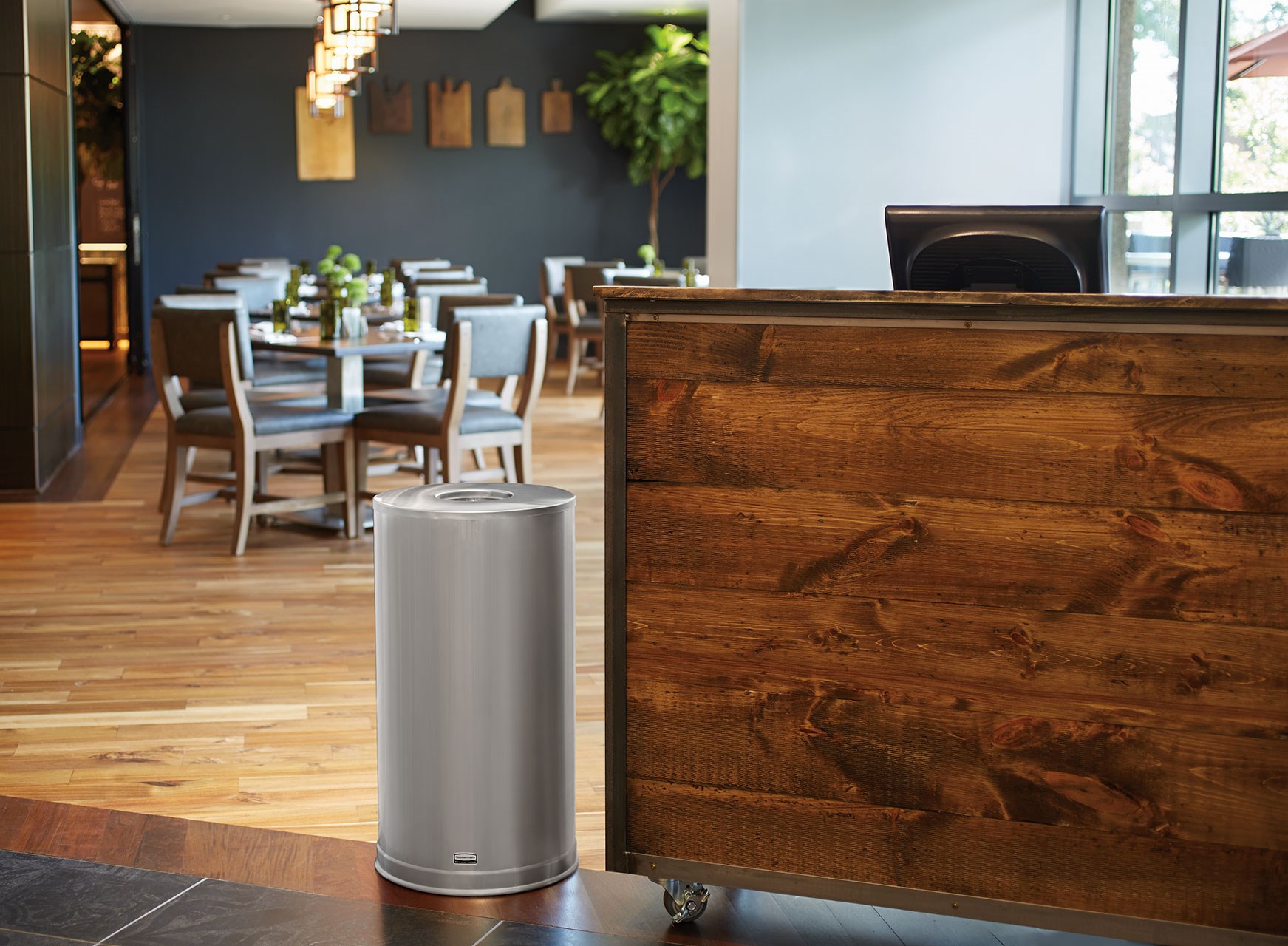 The Metallic Series 15 Gallon FGCC16 Indoor Waste Container has a sleek design that blends nicely with upscale interiors.