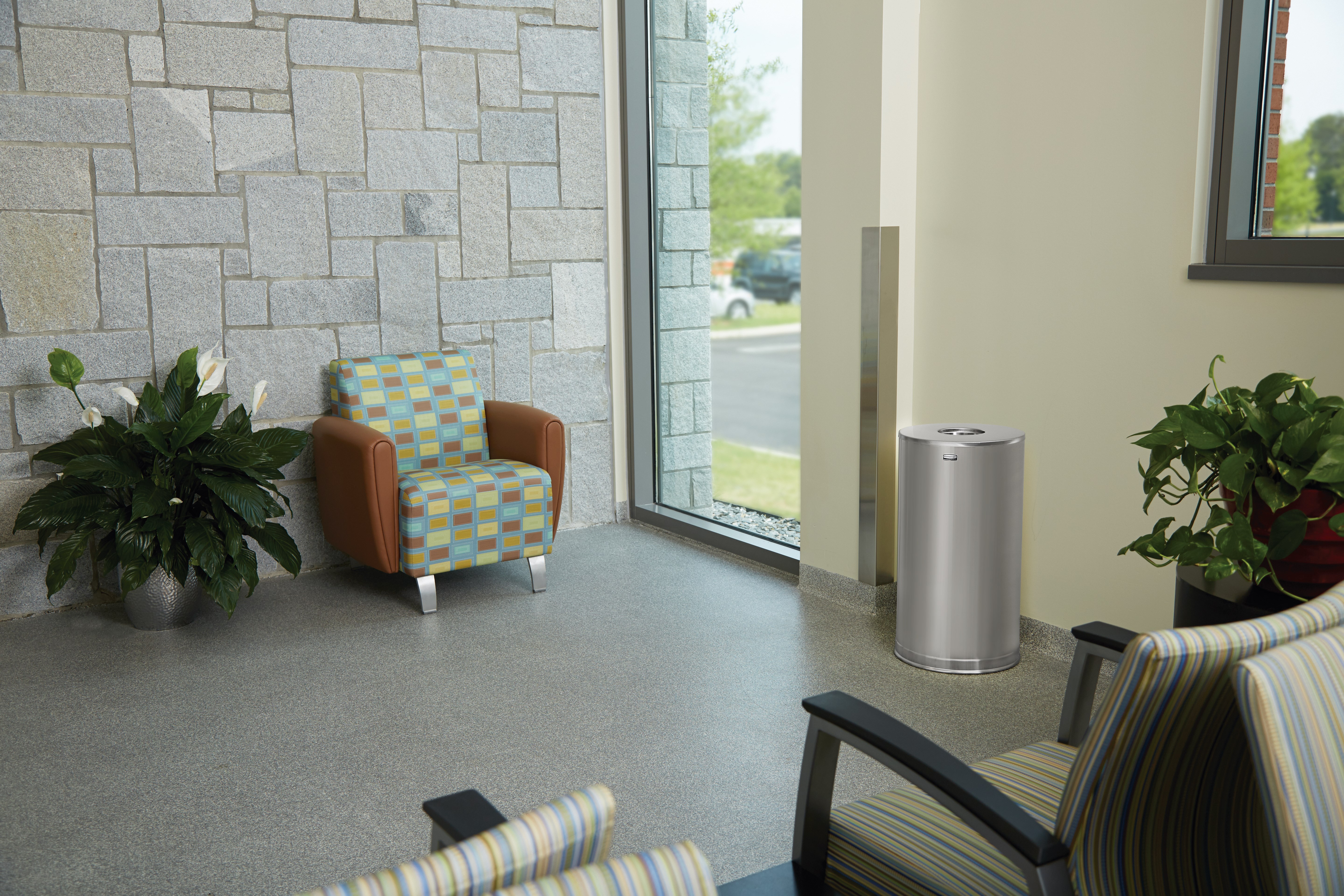 The Metallic Series 15 Gallon FGCC16 Indoor Waste Container has a sleek design that blends nicely with upscale interiors.