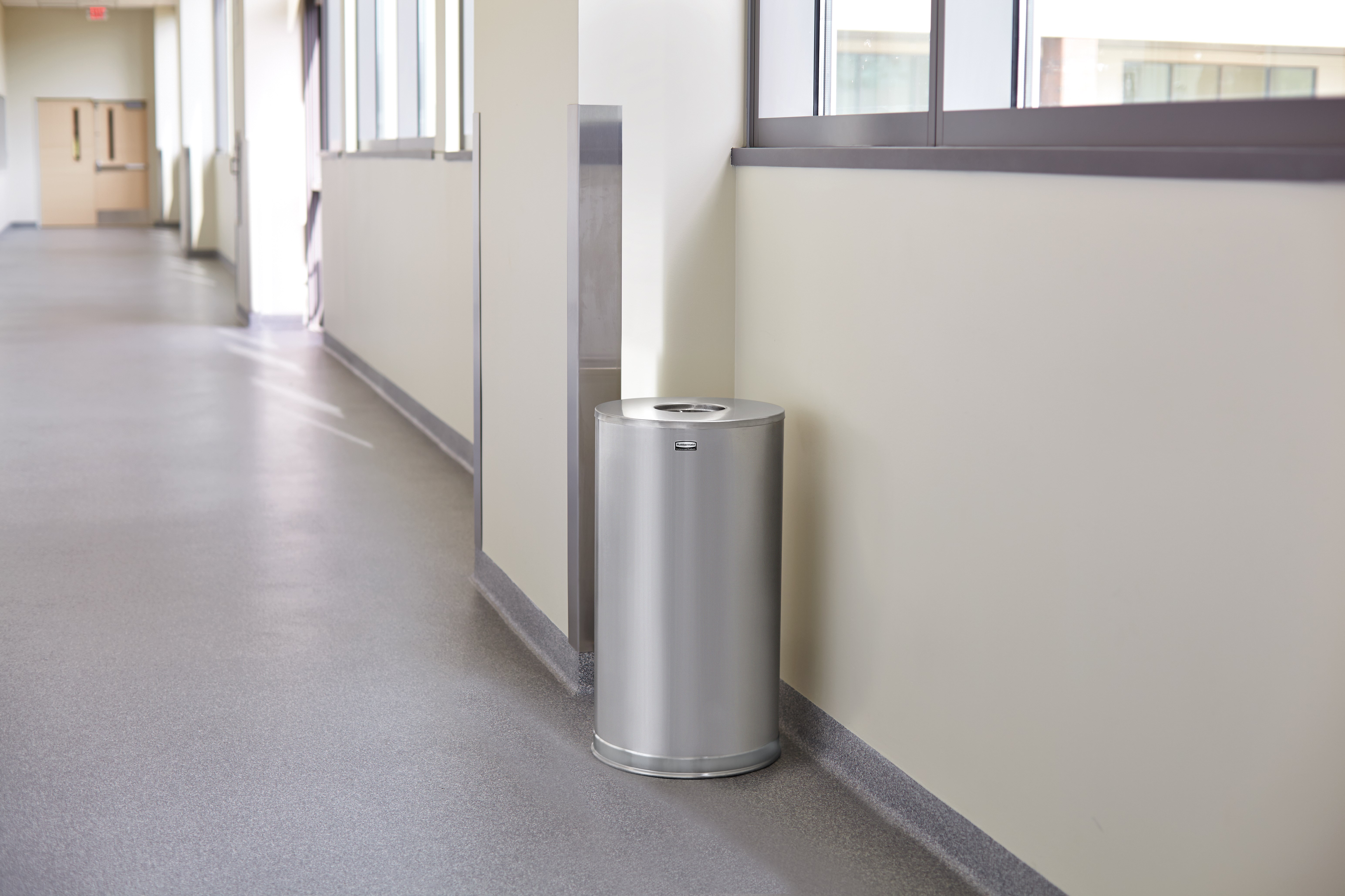 The Metallic Series 15 Gallon FGCC16 Indoor Waste Container has a sleek design that blends nicely with upscale interiors.