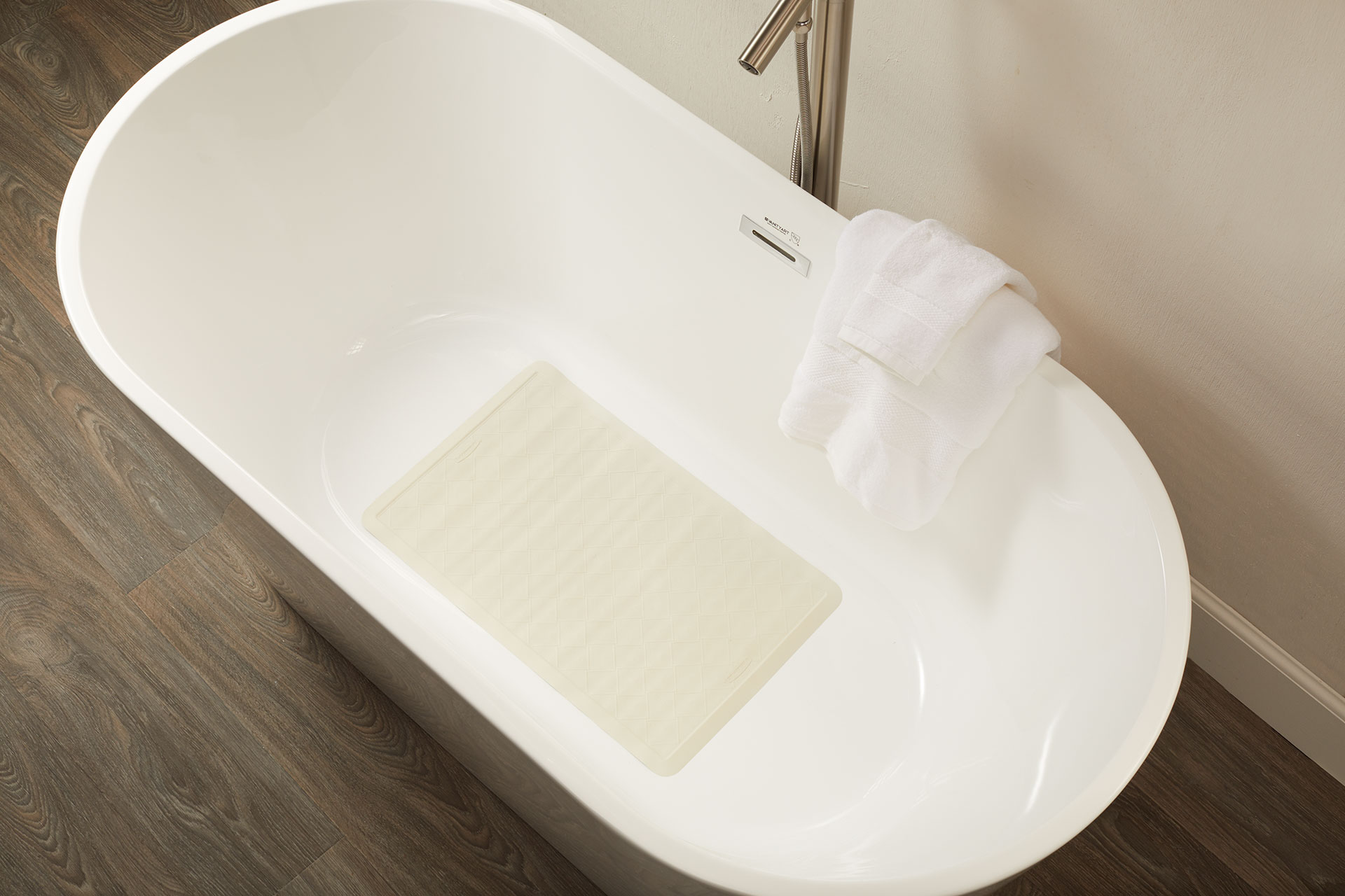 Safti-Grip® Bath Mat is perfect for a shower stall or bathtub. Suction-backed to stay firmly in place. Latex-free construction. Textured surface prevents slippage. Shower mat is perforated for improved drainage. Mildew-resistant.