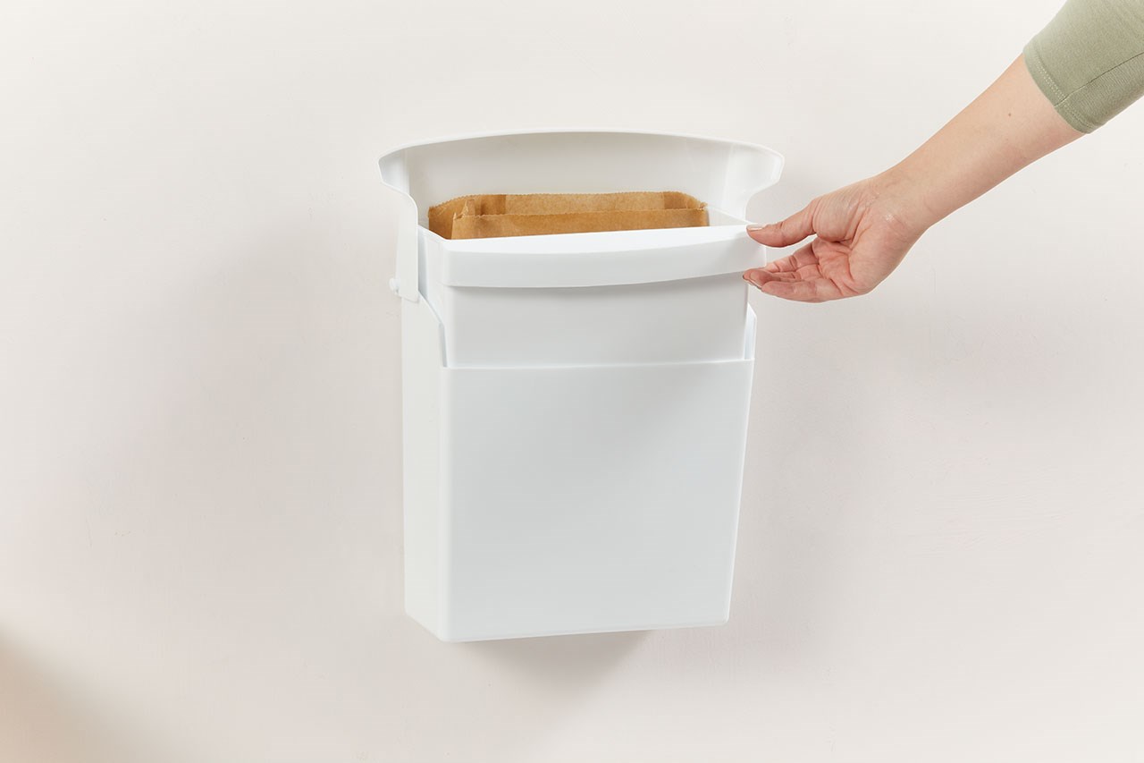 The Sanitary Bin has a wall-mounted design that is space-efficient and easy to service.