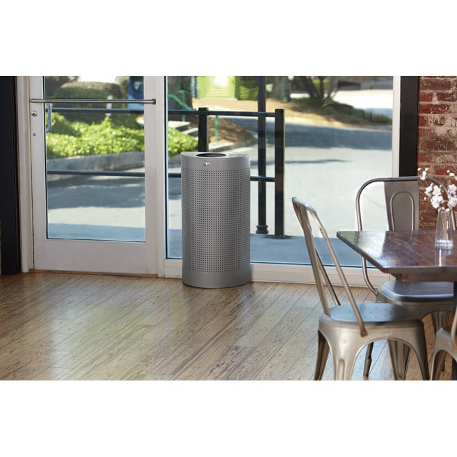 The Half Rounds Series indoor decorative waste container fits flush against walls to conserve space and reduce obstructions in high-traffic areas. The sleek and functional design of this receptacle blends seamlessly with upscale and modern indoor facilities.