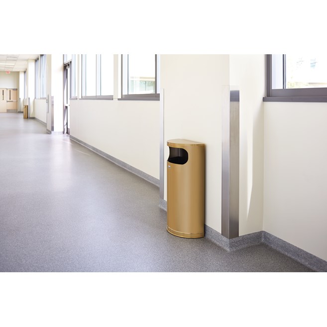 The Half Rounds Series indoor decorative waste container fits flush against walls to conserve space and reduce obstructions in high-traffic areas. The sleek and functional design of this receptacle blends seamlessly with upscale and modern indoor facilities.