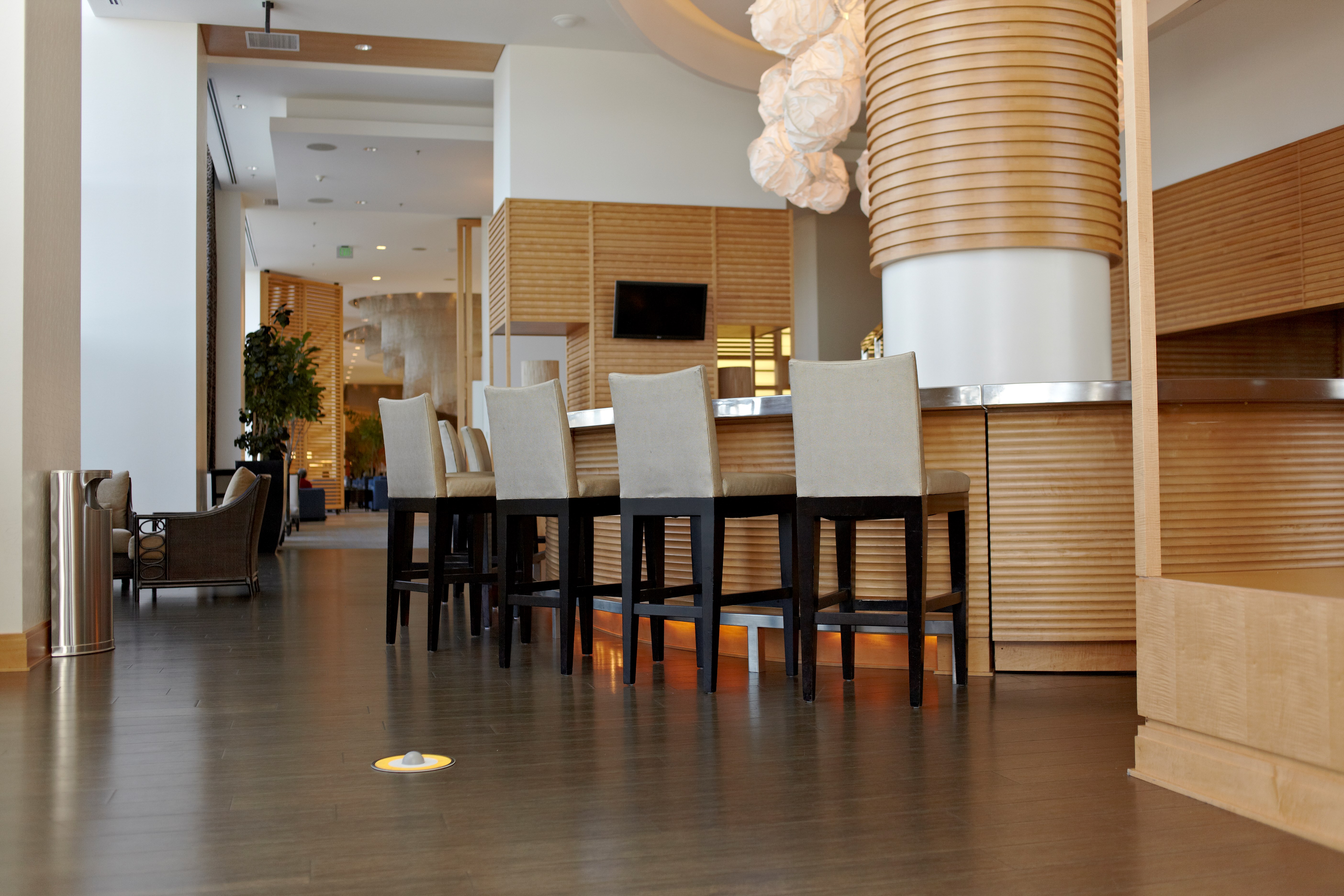 The Half Rounds Series indoor decorative waste container fits flush against walls to conserve space and reduce obstructions in high-traffic areas. The sleek and functional design of this receptacle blends seamlessly with upscale and modern indoor facilities.