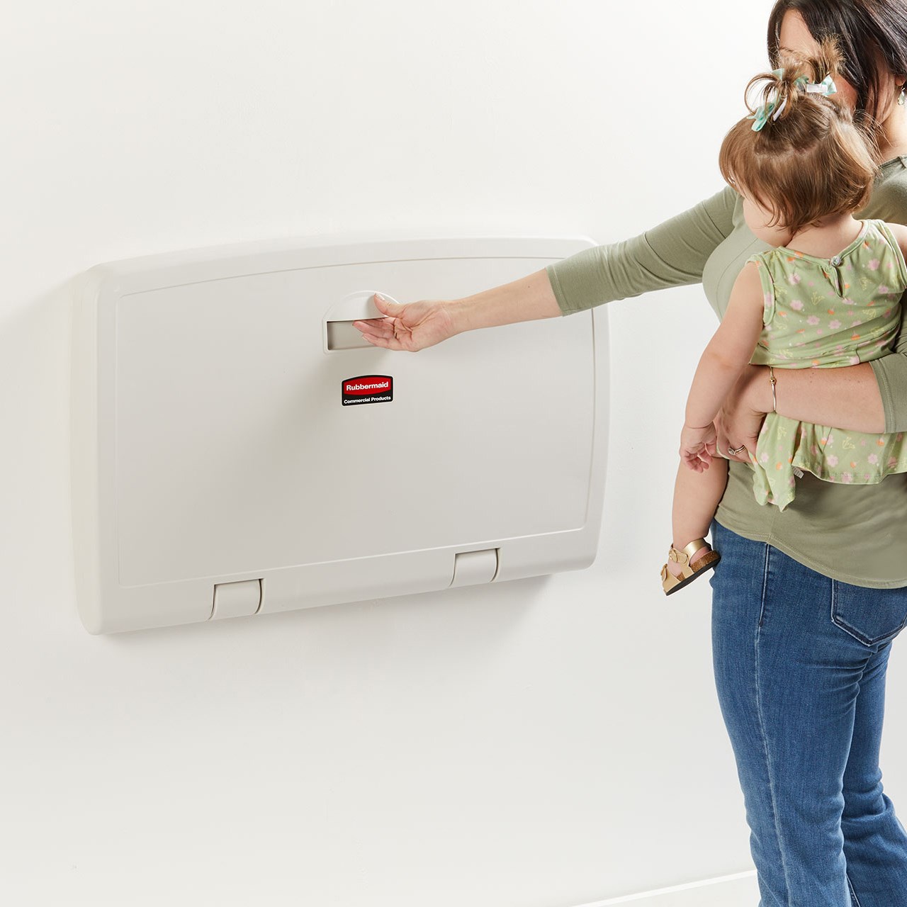 The Rubbermaid Commercial Products Baby Changing Station provides a secure changing station made from durable molded polypropylene. Ergonomic design opens conveniently with one hand, so guests can hold the baby while opening the table. Accessory shelf, liner holder and easy-reach hooks provide extra convenience.