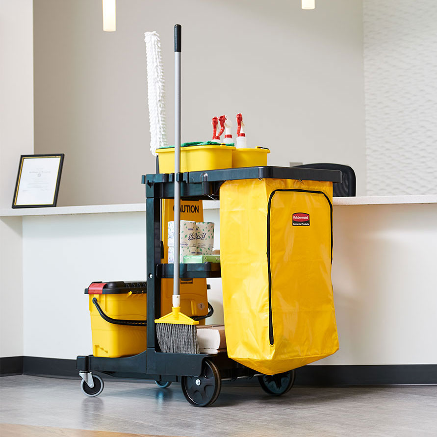 The Rubbermaid Commercial Traditional Janitorial Cleaning Cart with Zippered Yellow Bag collects waste and transports tools for efficient cleaning.