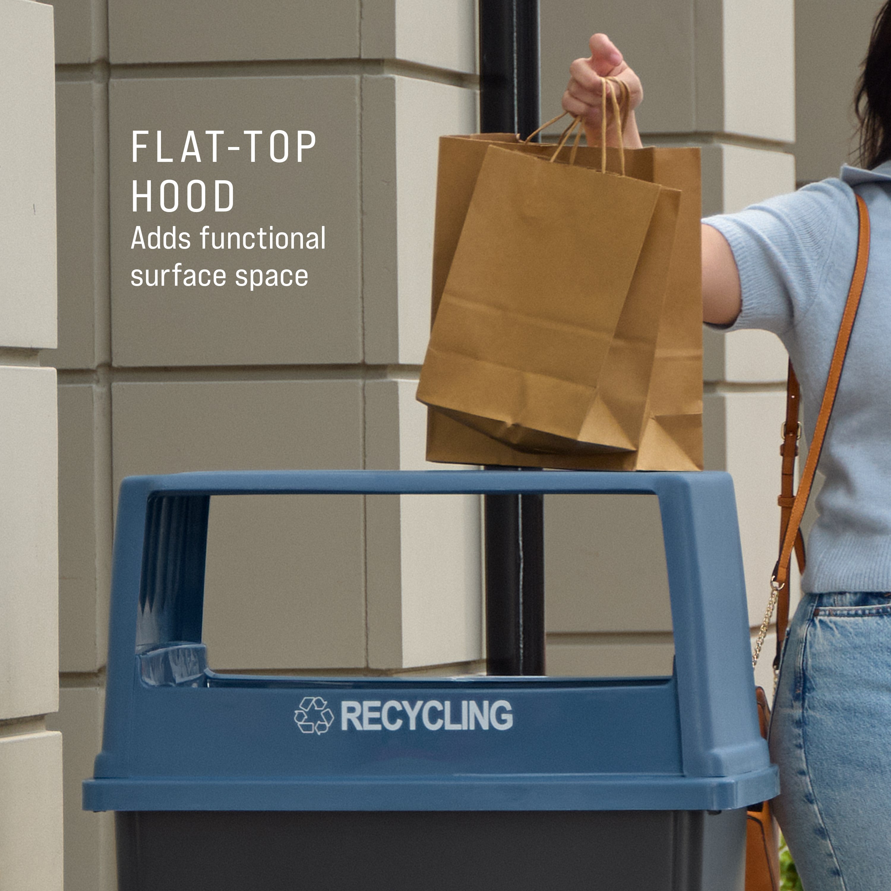 The Rubbermaid Commercial Products® Fulfill Hooded Recycling Top for 56 gallon containers features two large openings for hands-free recycling disposal.