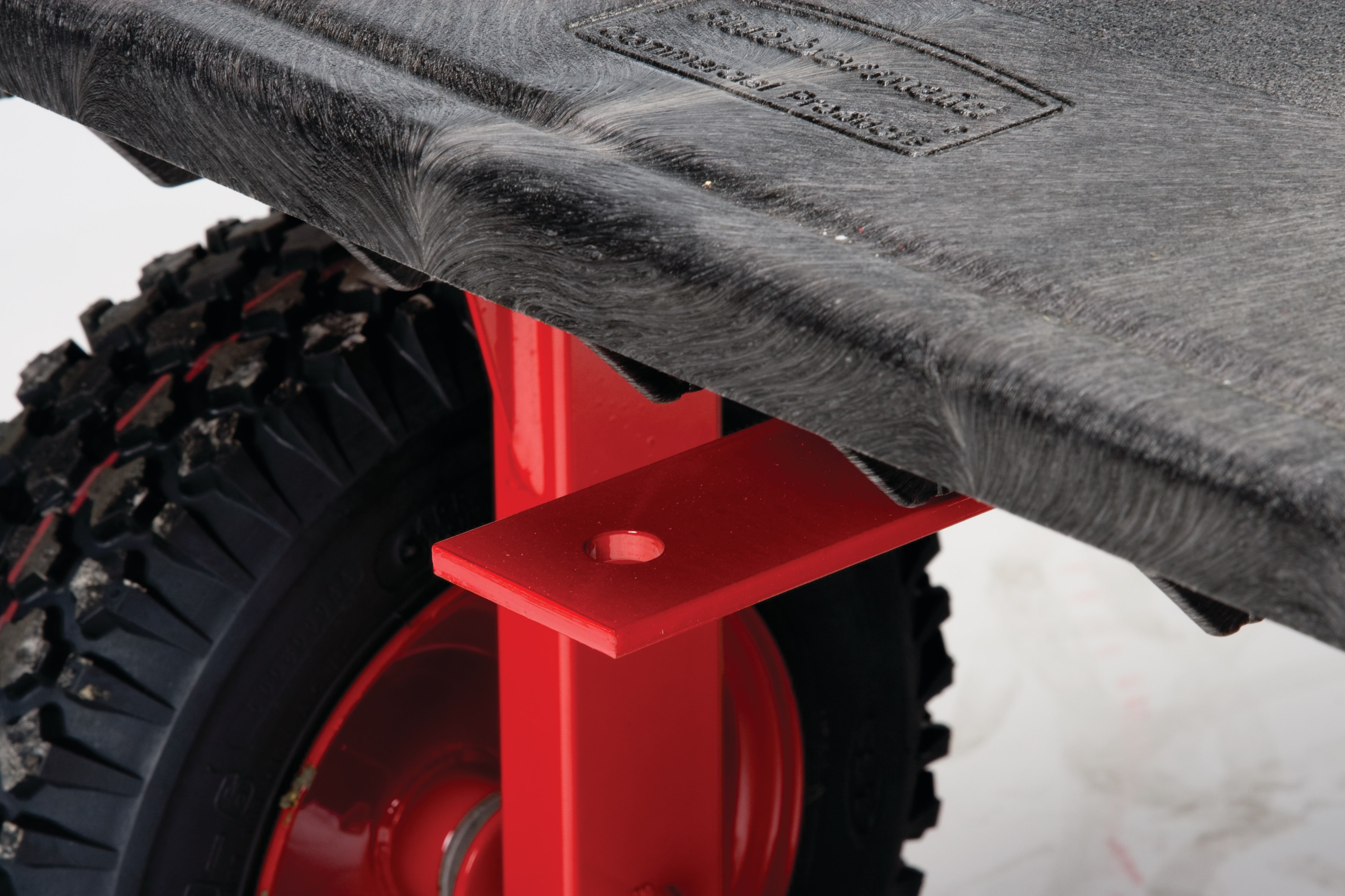 The Rubbermaid Commercial 5th Wheel Wagon Truck 70"X40" with 12" PNEUMATIC casters, 2000 lb. capacity