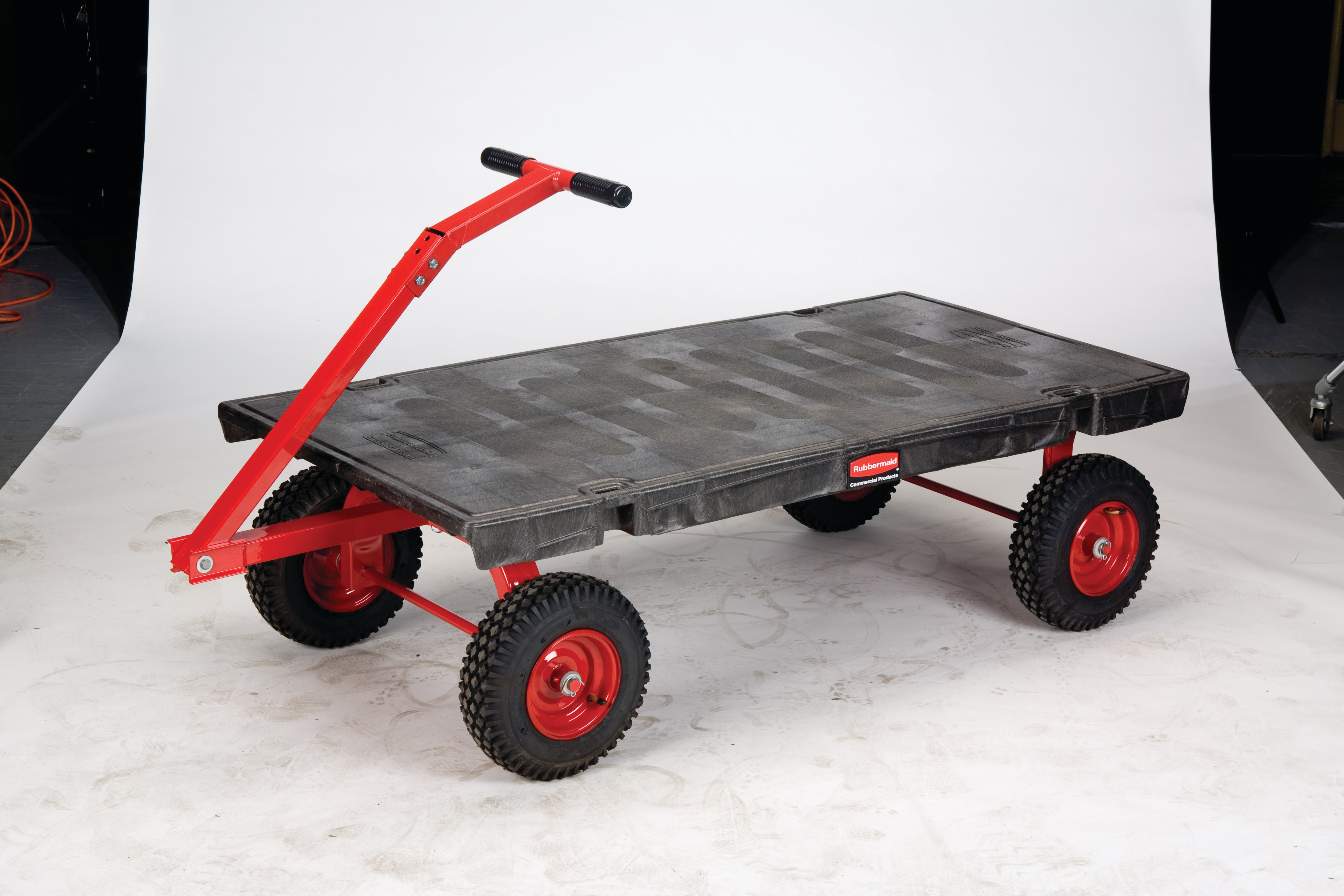 The Rubbermaid Commercial 5th Wheel Wagon Truck 30"X60" with 12" PNEUMATIC casters, 2000 lb. capacity