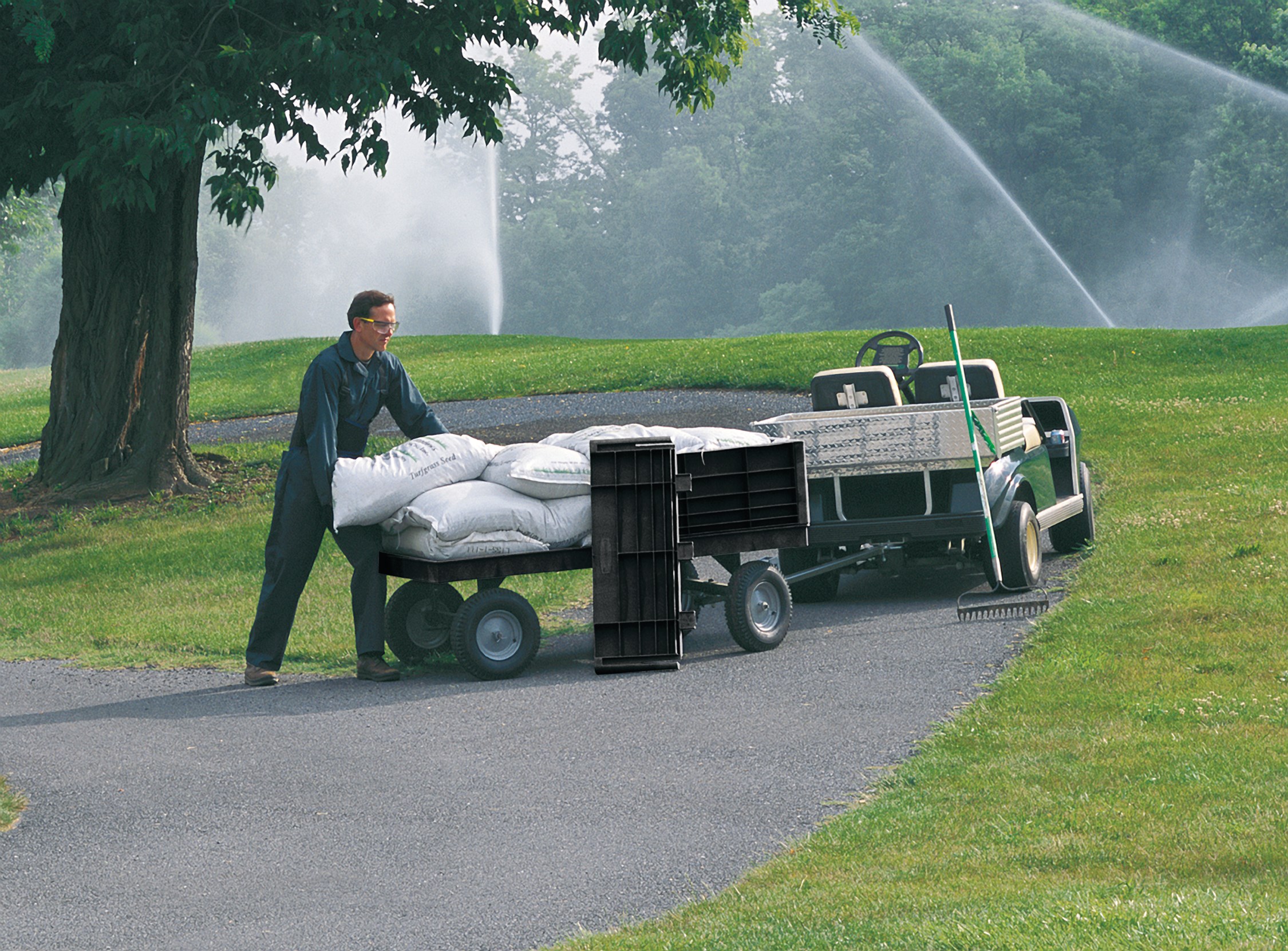 The Rubbermaid Commercial 5th Wheel Wagon Truck 70"X40" with 16"" PNEUMATIC casters, 2000 lb. capacity