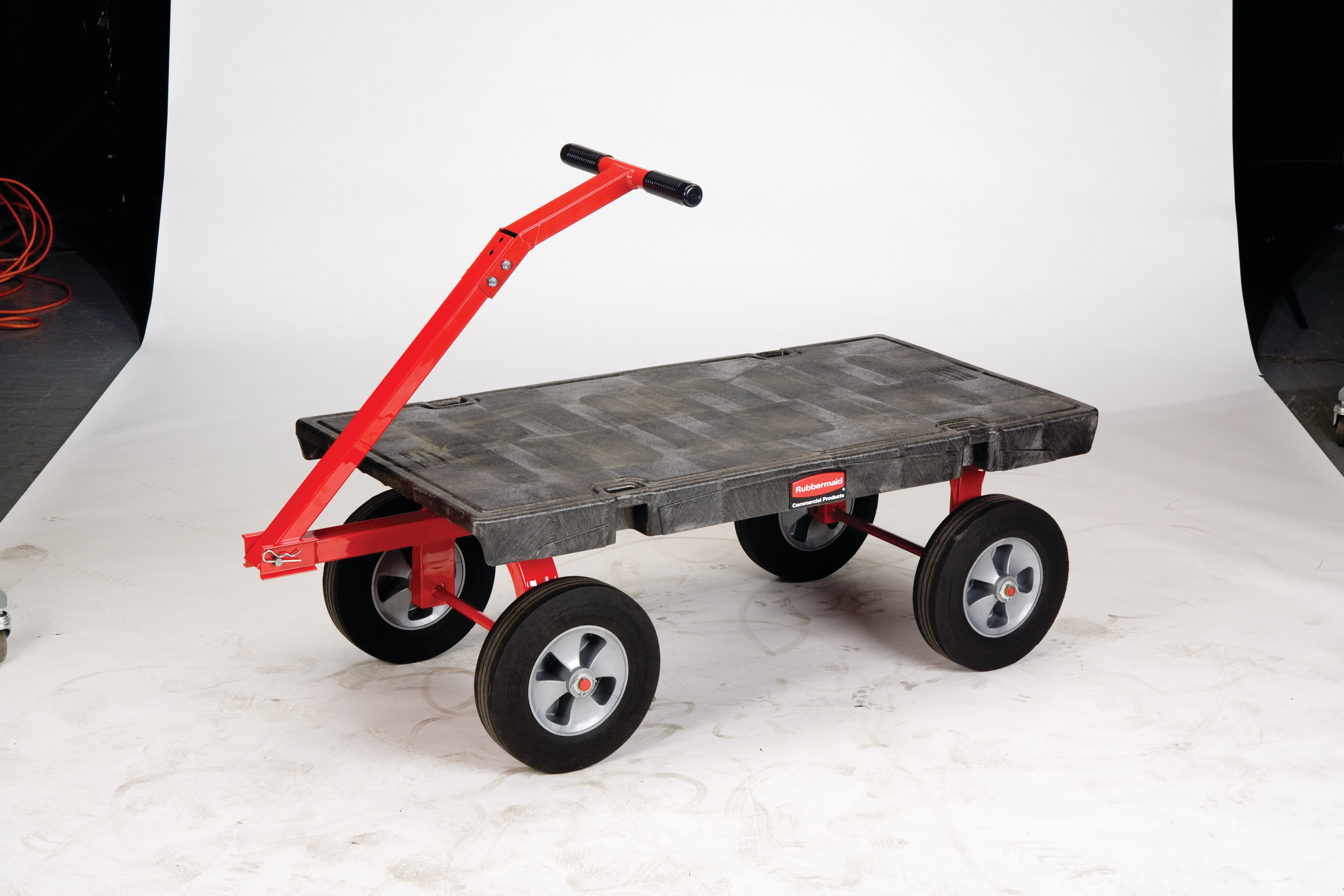 The Rubbermaid Commercial 5th Wheel Wagon Truck 24"X48" with 12" TPR wheels, 2000 lb. capacity