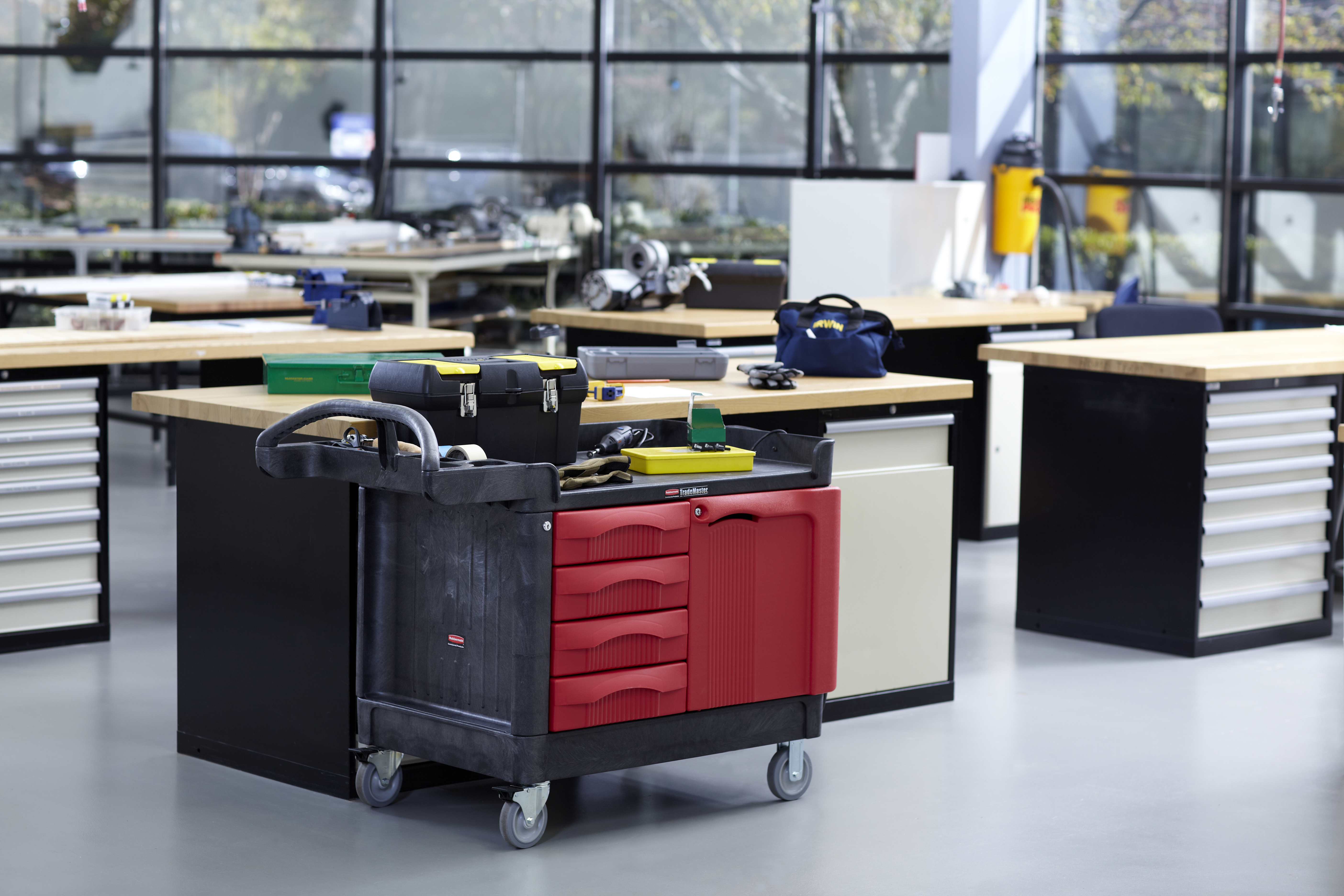 The Rubbermaid Commercial TradeMaster Mobile Work Center Utility Cart, 4 Drawer, easily transports tools and supplies where you need them.