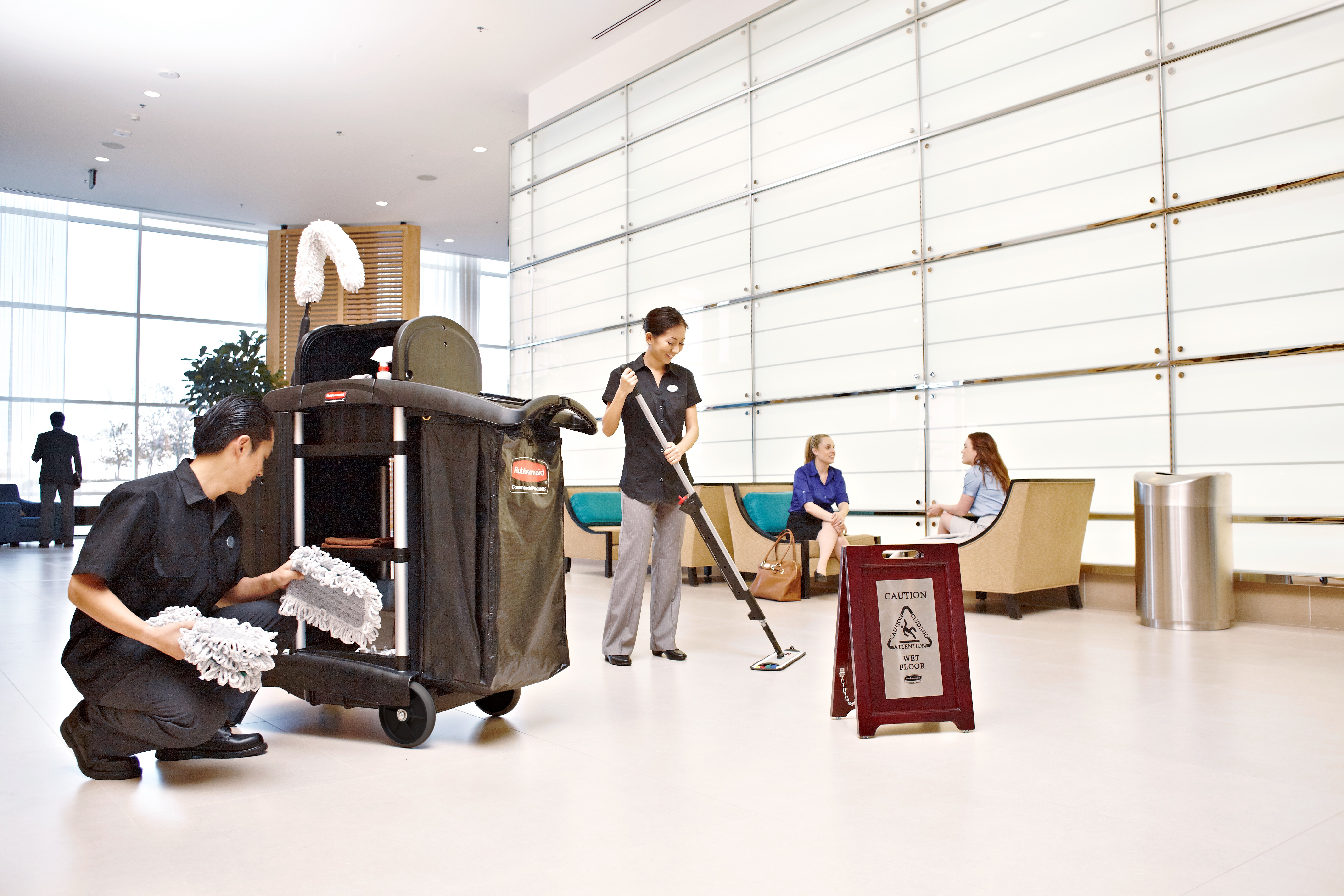 Elegant, dark hardwood "Caution" Sign is 2-sided for effective multilingual safety communication that won't disrupt a building's image.