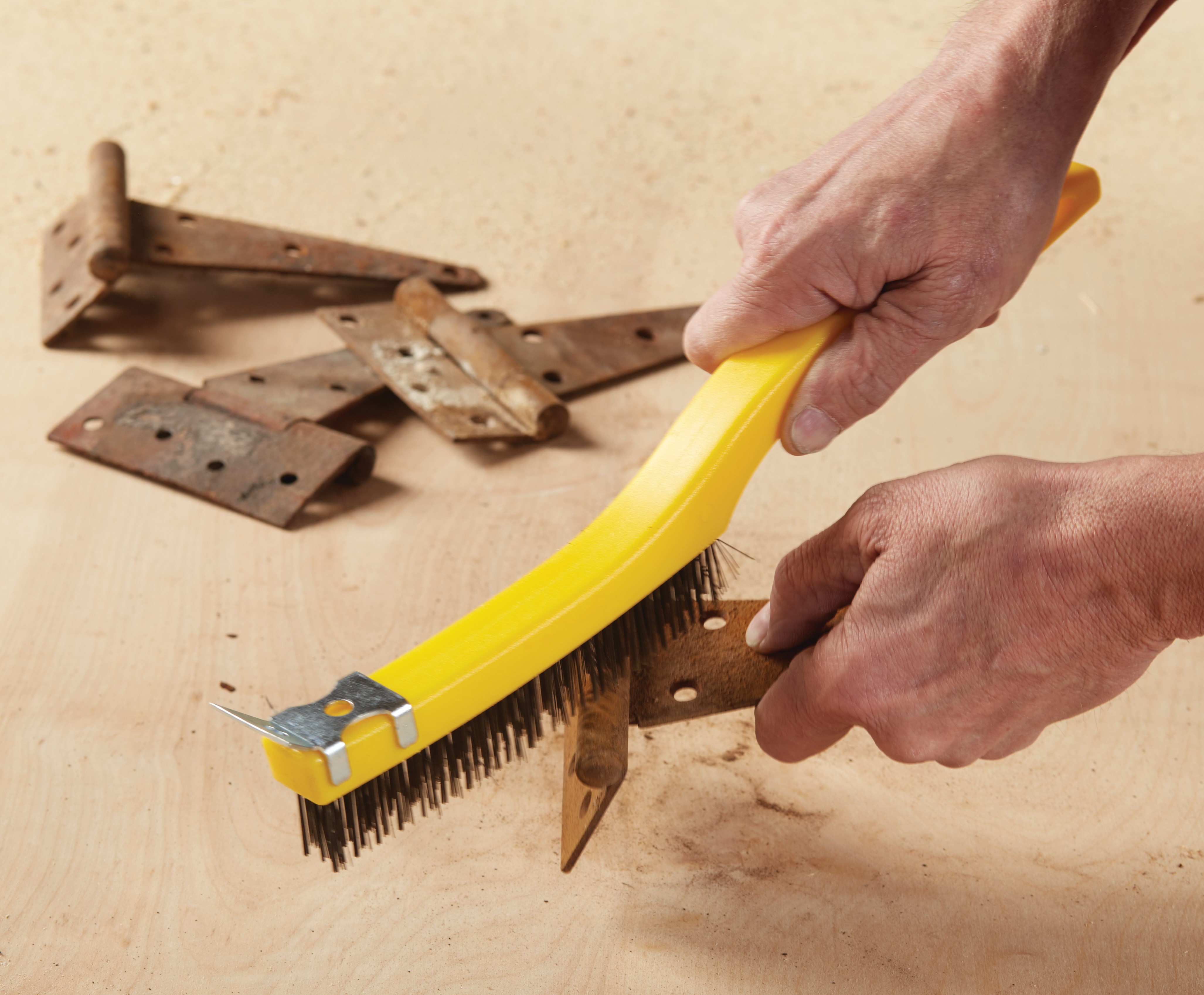 This brush has steel wire bristles. Long plastic handle. Includes a scraper for those needing extra cleaning power. 14-inch length, 3-inch by 19-inch bristle pattern.