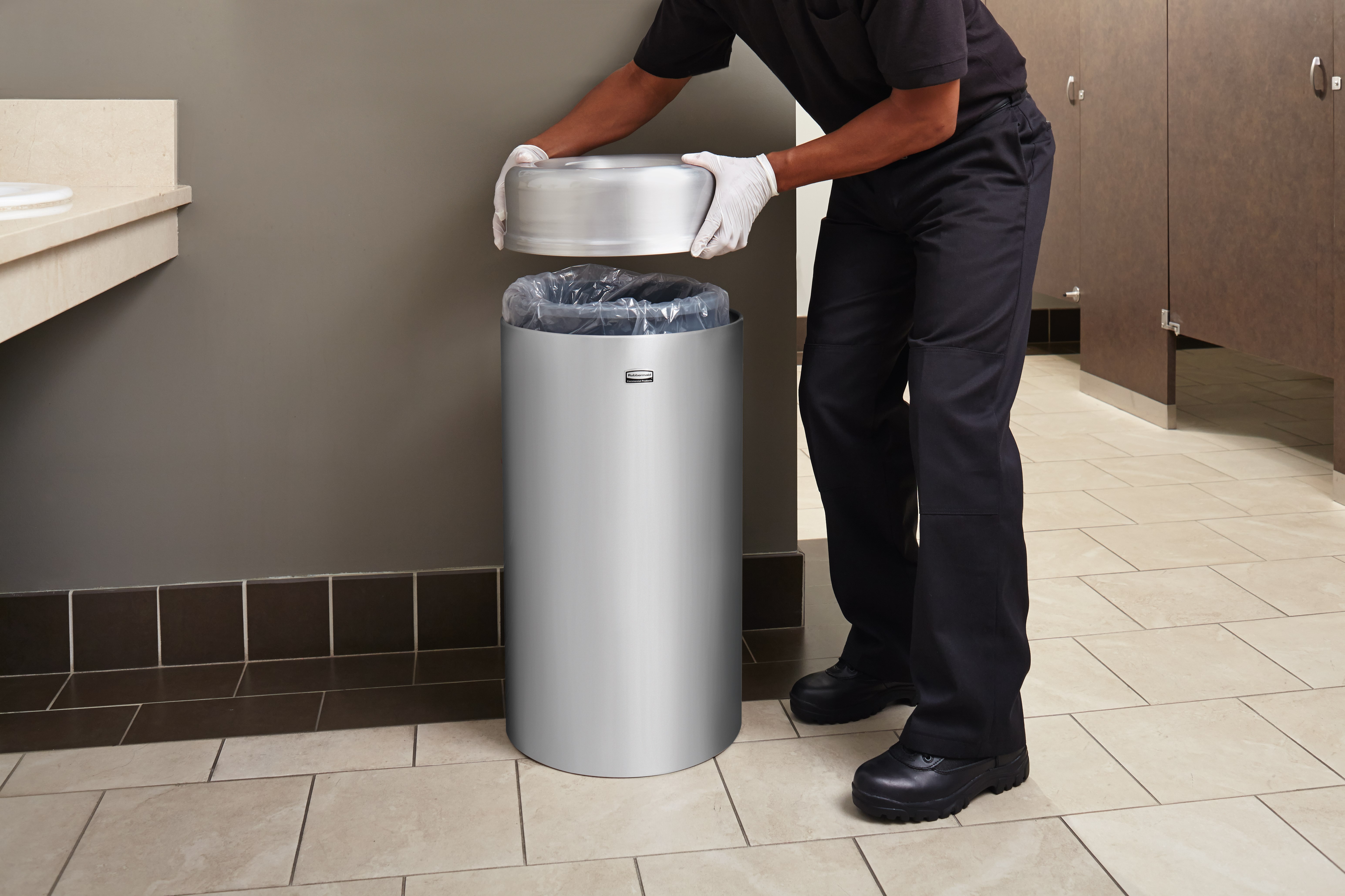 The Crowne Collection 30 Gallon FGAOT30 Decorative Indoor Waste Container has an attractive contemporary design with a curved open top that prevents objects from being placed on top of the can, keeping a neater overall appearance.