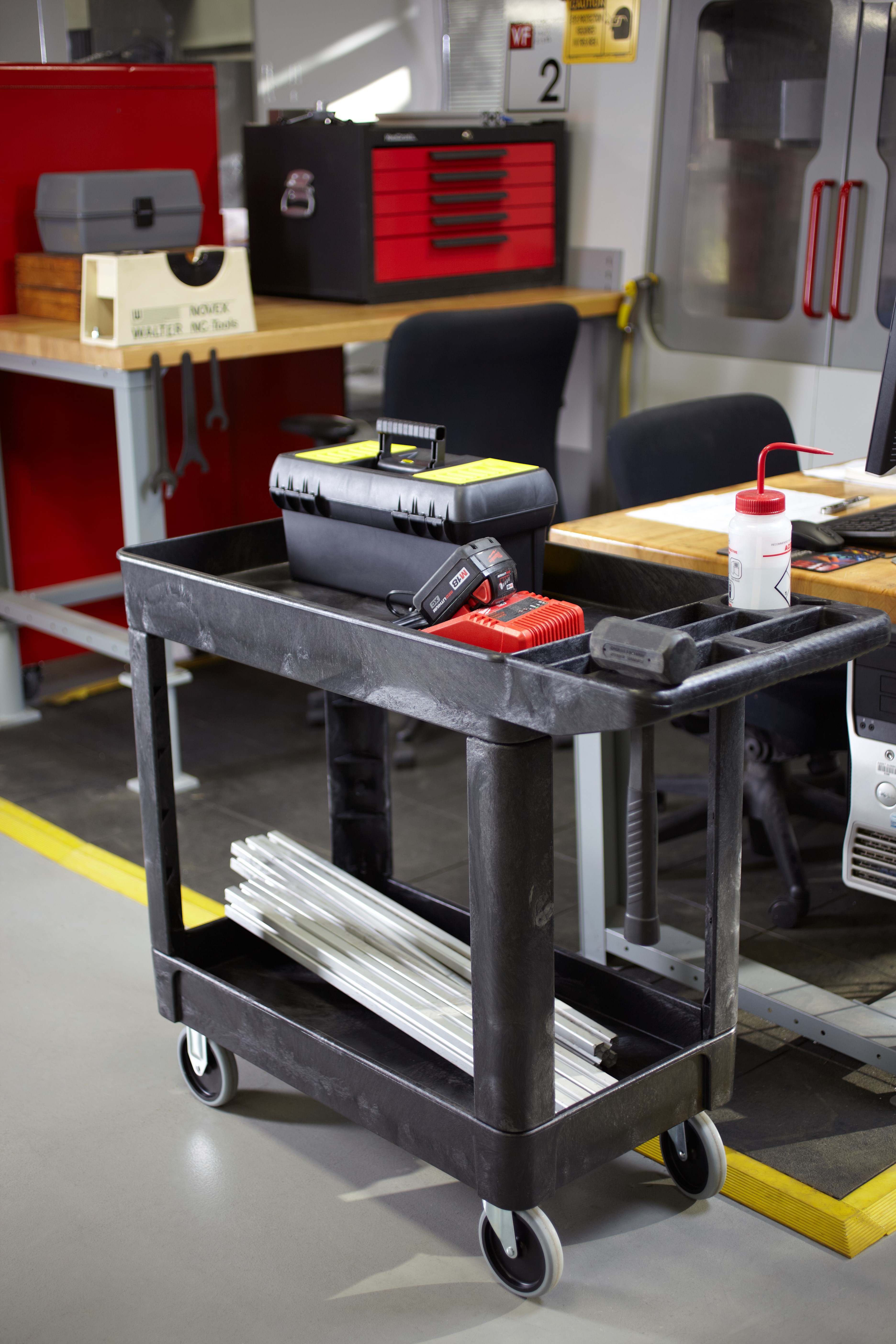 Heavy-Duty Utility Cart with Lipped Shelf transports materials, supplies, and heavy loads securely with up to 500 lbs. load capacity. The lipped shelves prevents items from falling off the cart and features an integrated V-notch to hold pipe and conduit securely for safe cutting.