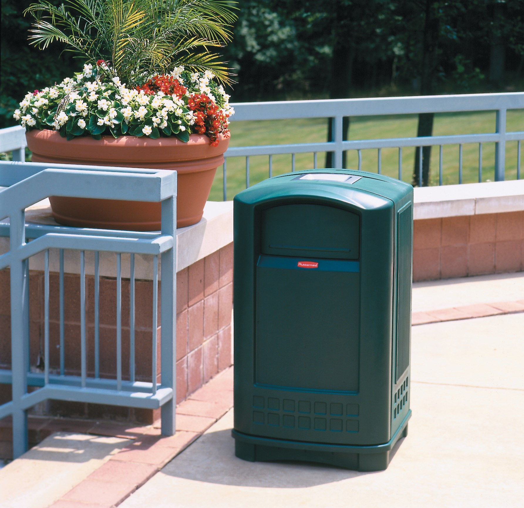 The Rubbermaid Commercial Plaza® Trash Can offers contemporary styling with a side-opening door for ergonomic waste emptying.