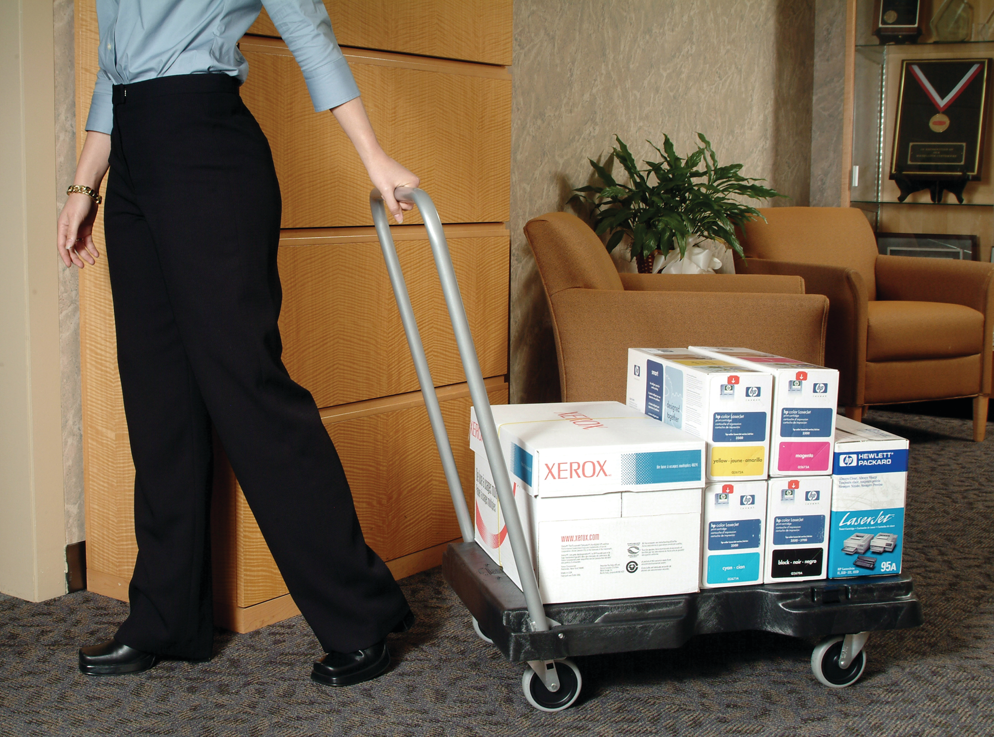 The Rubbermaid Commercial Triple Trolley efficiently transports large bulky loads and then folds flat for easy storage.